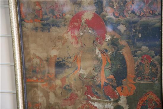 A thangka depicting Green Tara, Tibet, 19th century 67cm x 45cm, worn